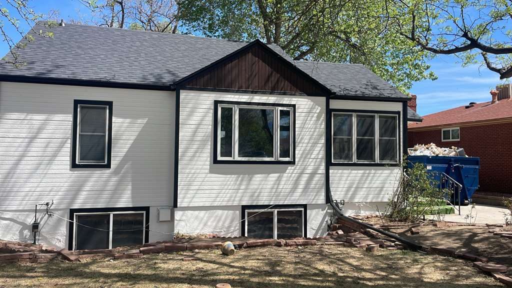 After: Denver metro · Rear repaint, stained cedar gable · White body, dark cedar stain