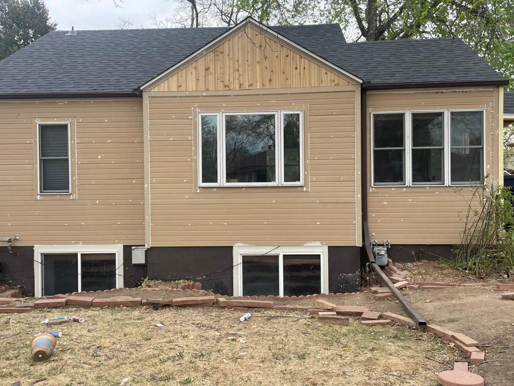 Before: Denver metro · Rear repaint, stained cedar gable · White body, dark cedar stain