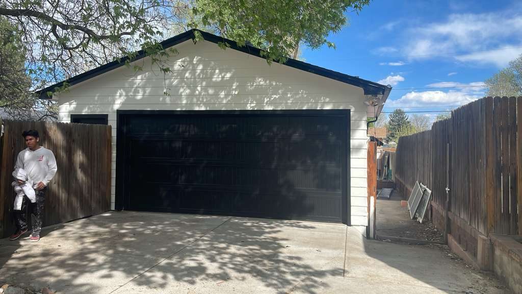 After: Denver metro · Detached garage repaint · White with glossy black door
